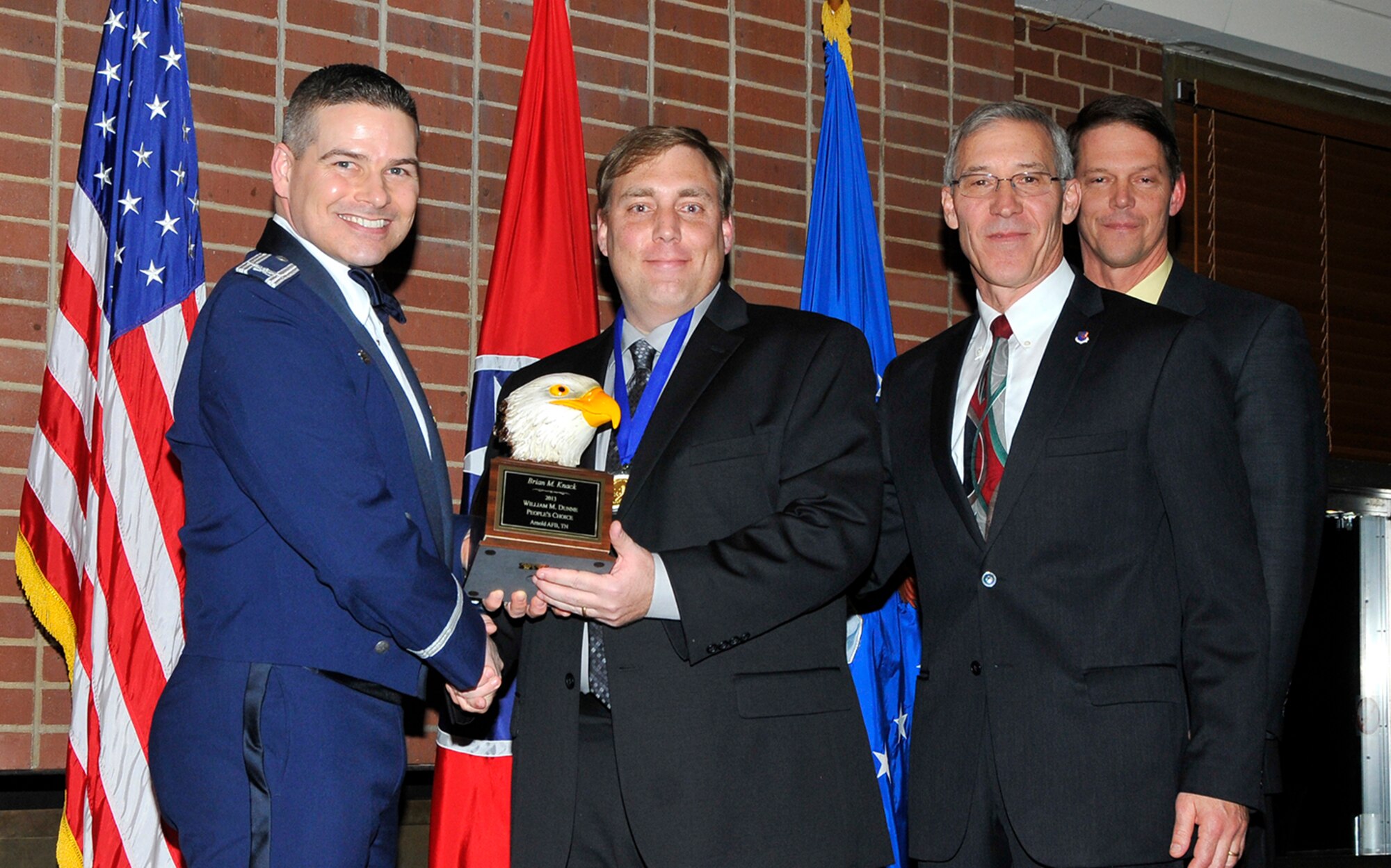 Brian Knack (2nd from left) receives the Annual William M. Dunne People’s Choice award from AEDC Commander Col. Raymond Toth (far left), ATA Deputy General Manager Phil Stich (3rd from left) and AEDC Executive Director Dr. Douglas Blake at the AEDC Annual Award Banquet.