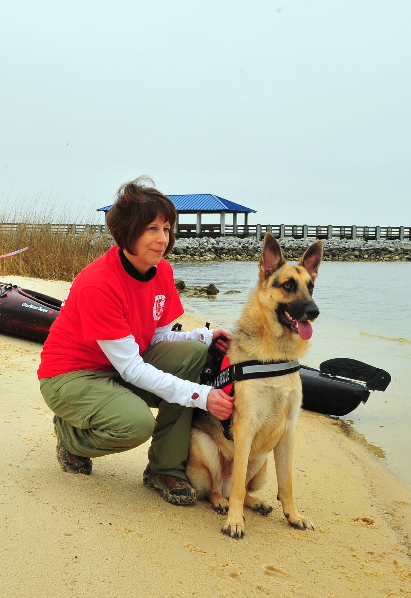 Master Sgt. Spring J. Winters, a 403rd Wing reservist who works as an Air Reserve Technician at the 403rd Maintenance Group at Keesler Air Force Base, Miss., and her one-year-old German Shepherd "Rico" volunteer with the Gulf Coast Search and Rescue, the Harrison County Community Emergency Response Team. (U.S. Air Force photo/Maj. Marnee A.C. Losurdo)
