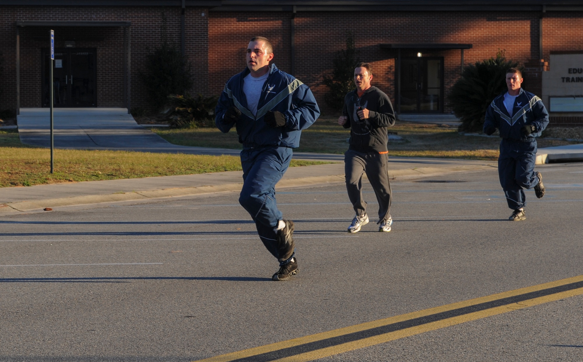 Airmen finish together during a Valentine’s Day 5k at Moody Air Force Base, Ga., Feb. 14, 2014. Participants of the run finished in times ranging from roughly 19 to 41 minutes. (U.S. Air Force photo by Airman 1st Class Alexis Millican/Released)