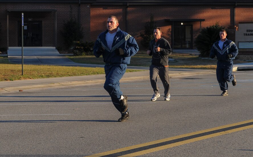 Airmen finish together during a Valentine’s Day 5k at Moody Air Force Base, Ga., Feb. 14, 2014. Participants of the run finished in times ranging from roughly 19 to 41 minutes. (U.S. Air Force photo by Airman 1st Class Alexis Millican/Released)