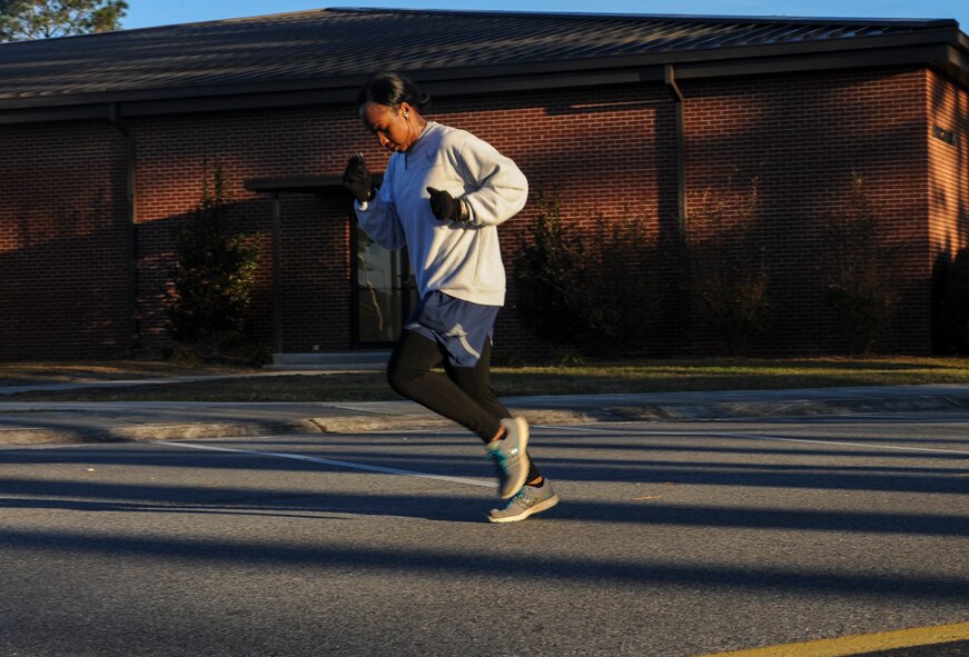 U.S. Air Force Staff Sgt. Talisha Jeffries, 822d Base Defense Squadron fire team leader, runs to the finish line of a Valentine’s Day 5k at Moody Air Force Base, Ga., Feb. 14, 2014. Jeffries was just one of about 100 individuals who participated in the event. (U.S. Air Force photo by Airman 1st Class Alexis Millican/Released)