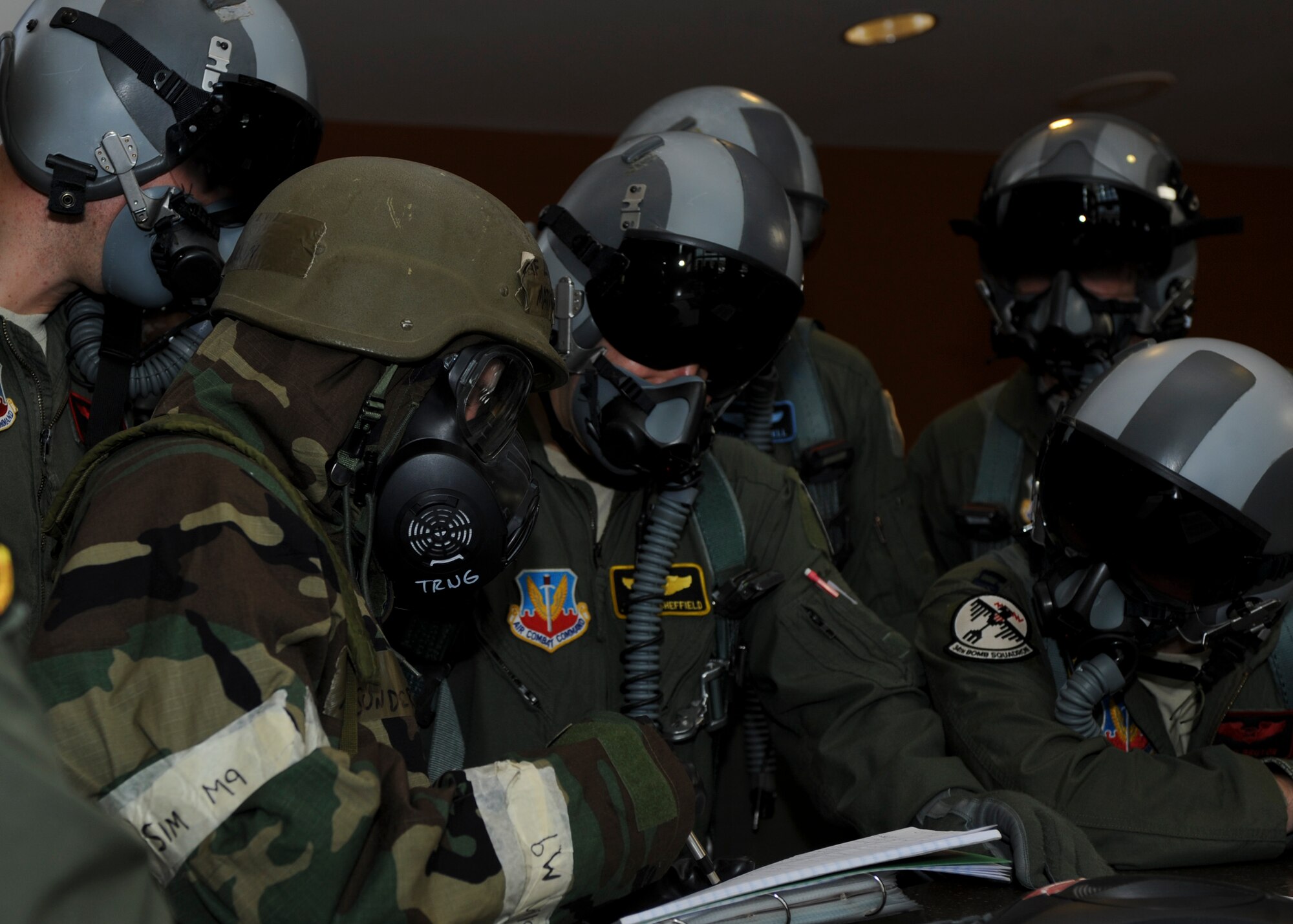 Airman 1st Class Matthew Sunderlin, 28th Operations Support Squadron intelligence analyst technician, provides a pre-flight brief to a B-1 aircrew prior to them stepping to the aircraft during a phase II operational readiness exercise at Ellsworth Air Force Base, S.D., Feb. 13, 2014. The intent of the exercise is to evaluate the wing's ability to meet wartime and contingency tasks of employing forces, sustaining forces and maintaining the ability to survive and operate in a deployed location. (U.S. Air Force photo by Senior Airman Anania Tekurio/Released)