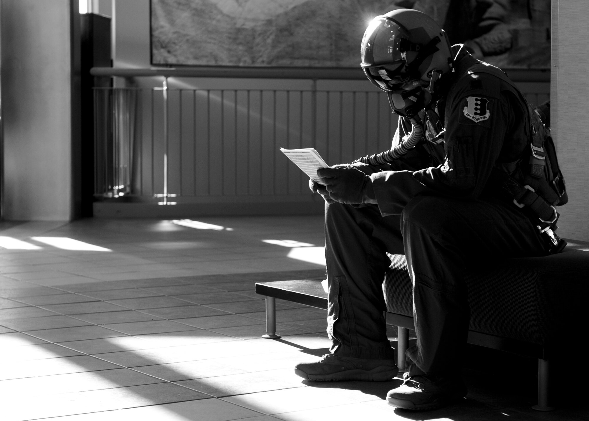 Capt. Ross Hobbs, 34th Bomb Squadron B-1 pilot, reviews flight information during an alarm black drill as part of a phase II operational readiness exercise at Ellsworth Air Force Base, S.D., Feb. 13, 2014. The exercise is one way Ellsworth world class Airmen continuously hone their skills in their commit to providing expeditionary combat power anywhere on the globe. (U.S. Air Force photo by Senior Airman Anania Tekurio/Released)