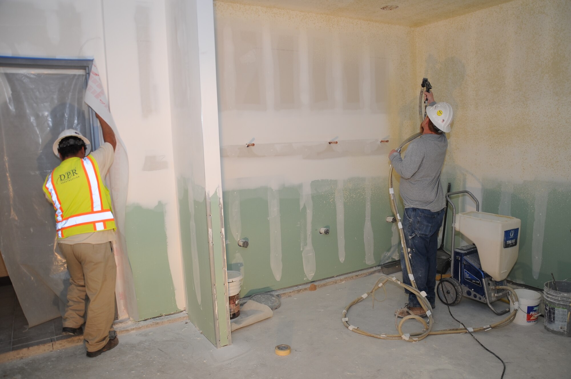 Contractors work on the new shower facilities Feb. 7 at Luke Air Force Base Fire Station 361. The fire station is adding more sinks, urinals, showers and lockers to accommodate an increase in manning. (U.S. Air Force photo/Staff Sgt. Luther Mitchell Jr.)