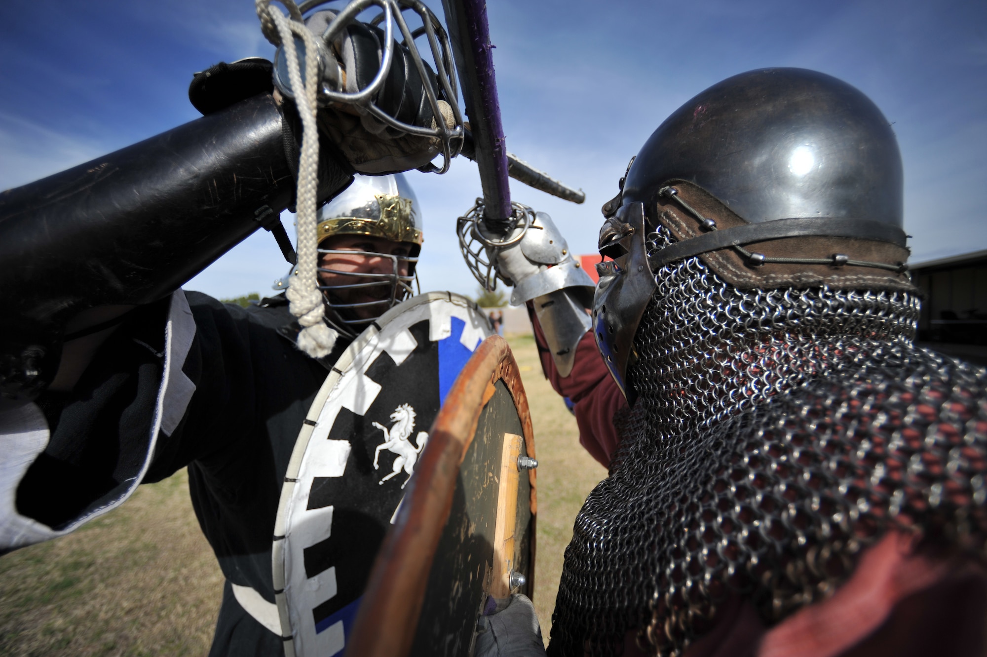 Aerin Rosenberg, Knight of Barony of Atenveldt, practices with Maj. Andrew Hoeffler, 56th Medical Operations Squadron family nurse practitioner and squire of Atenveldt, during the Heroes for Silent Angels event setup Feb. 7 in Phoenix. Rosenberg and Hoeffler are both part of the Society for Creative Anachronisms, helping raise funds for Rett Syndrome research. (U.S. Air Force photo/Senior Airman Jason Colbert)