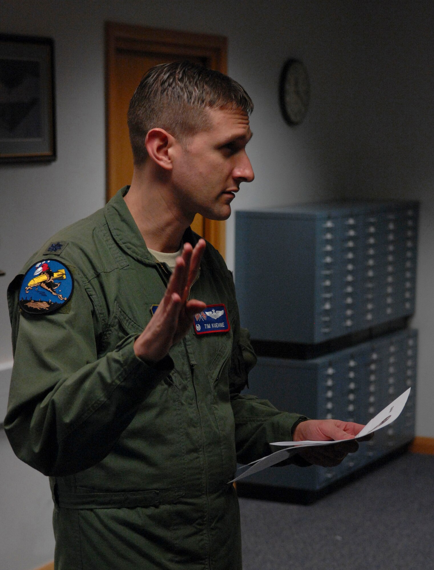 U.S. Air Force Lt. Col. Timothy Kuehne, 351st Air Refueling Squadron commander from Woodbridge, Va., addresses Airmen during roll call Feb. 7, 2014, on RAF Mildenhall, England. Every Friday at 3:51 p.m., Airmen from the 351st ARS gather to remember the heritage of the 351st Bomb Squadron. (U.S. Air Force photo by Senior Airman Micaiah Anthony/Released)