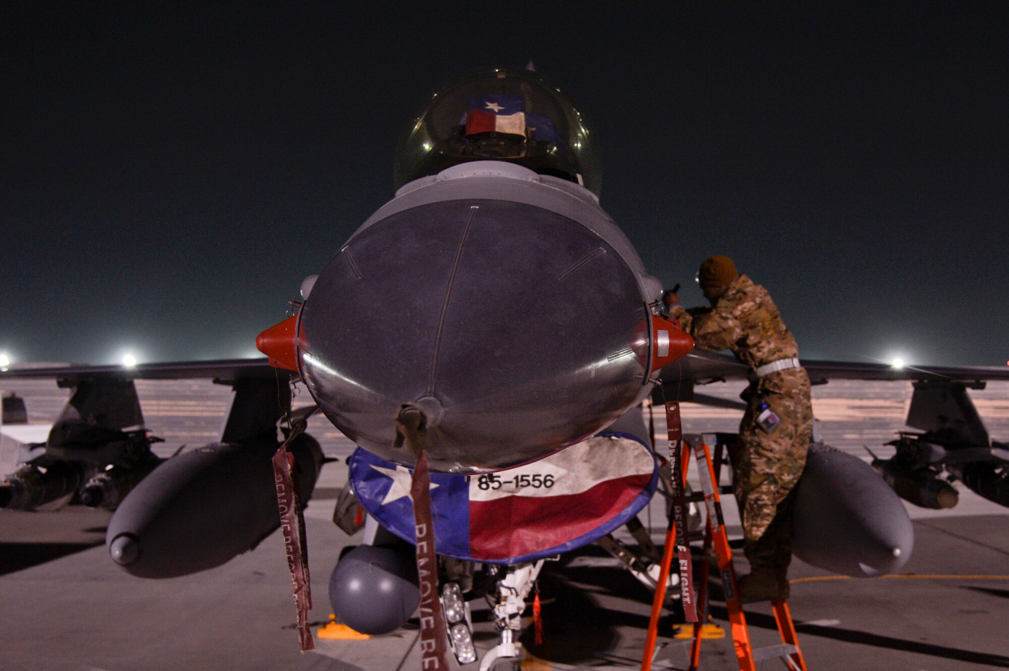 U.S. Air Force Senior Airman Booker Bryant, 455th Expeditionary Aircraft Maintenance Squadron weapons journeyman, performs maintenance on an F-16 Fighting Falcon at Bagram Airfield, Afghanistan, Feb. 13, 2014. Bryant is deployed from 482nd Fighter Wing at Homestead Air Reserve Base, Fla. (U.S. Air Force photo by Senior Airman Kayla Newman/Released)