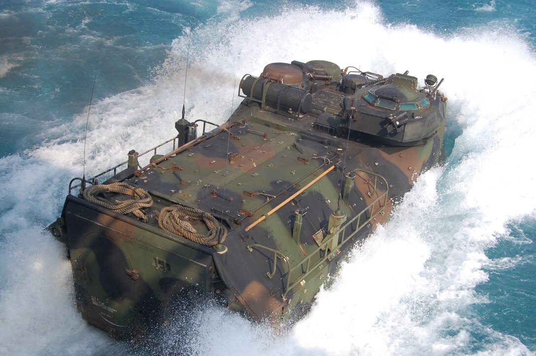 GULF OF THAILAND – Marines attached to Combat Assault Battalion Amphibious Assault Vehicle General Support Platoon, drive an amphibious P7 Ram RS vehicle off USS Denver (LPD 9) as part of an amphibious assault exercise. Denver is participating in exercise Cobra Gold 2014, which is a multinational exercise conducted annually to promote interoperability and training between participating nations.