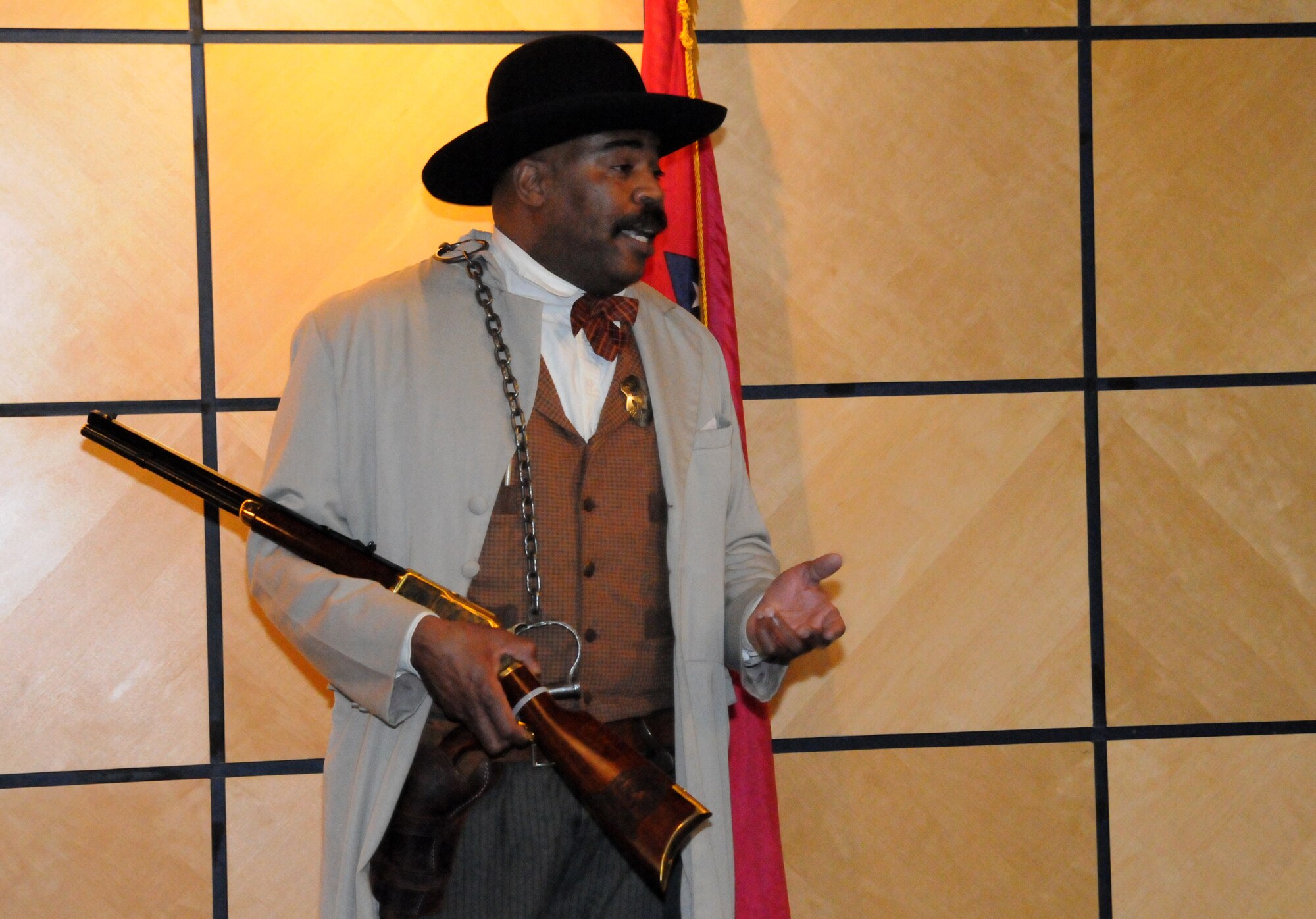 Baridi Nkokheli, City of Fort Smith director of sanitation, conducts a Bass Reeves presentation at a Black History Month event held at the 188th Fighter Wing headquarters auditorium Feb. 9, 2014. Because of his resemblance to the former U.S. Marshal and Van Buren, Ark., native Reeves, Nkokheli often re-enacts the character of Reeves in presentations around the area. (U.S. Air National Guard photo by Airman 1st Class Cody Martin) 