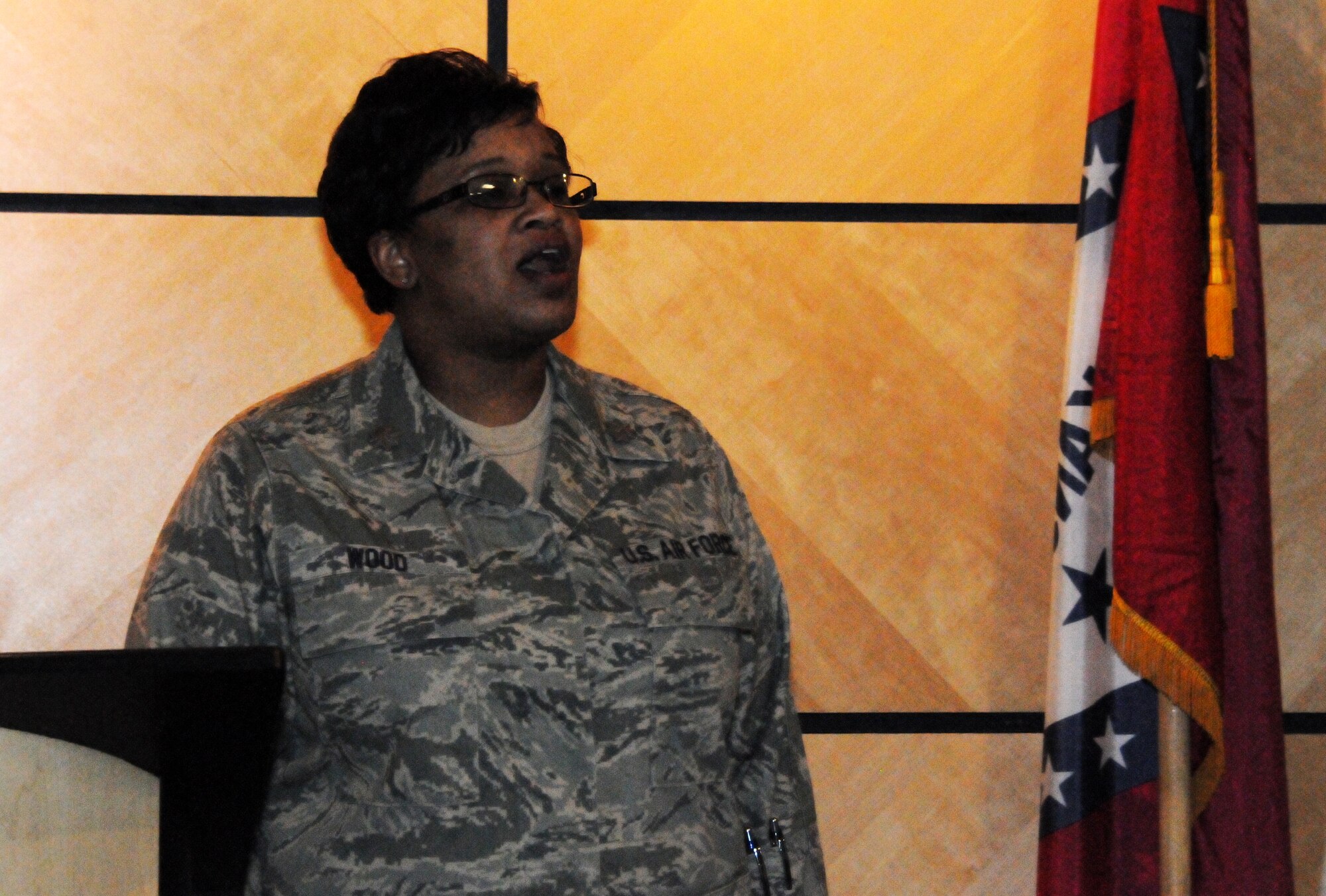 Maj. Danielle Wood, 188th Equal Opportunity officer, sings the Negro National Anthem to kick off a Black History Month event at the 188th Fighter Wing headquarters auditorium Feb. 9, 2014. (U.S. Air National Guard photo by Airman 1st Class Cody Martin) 
