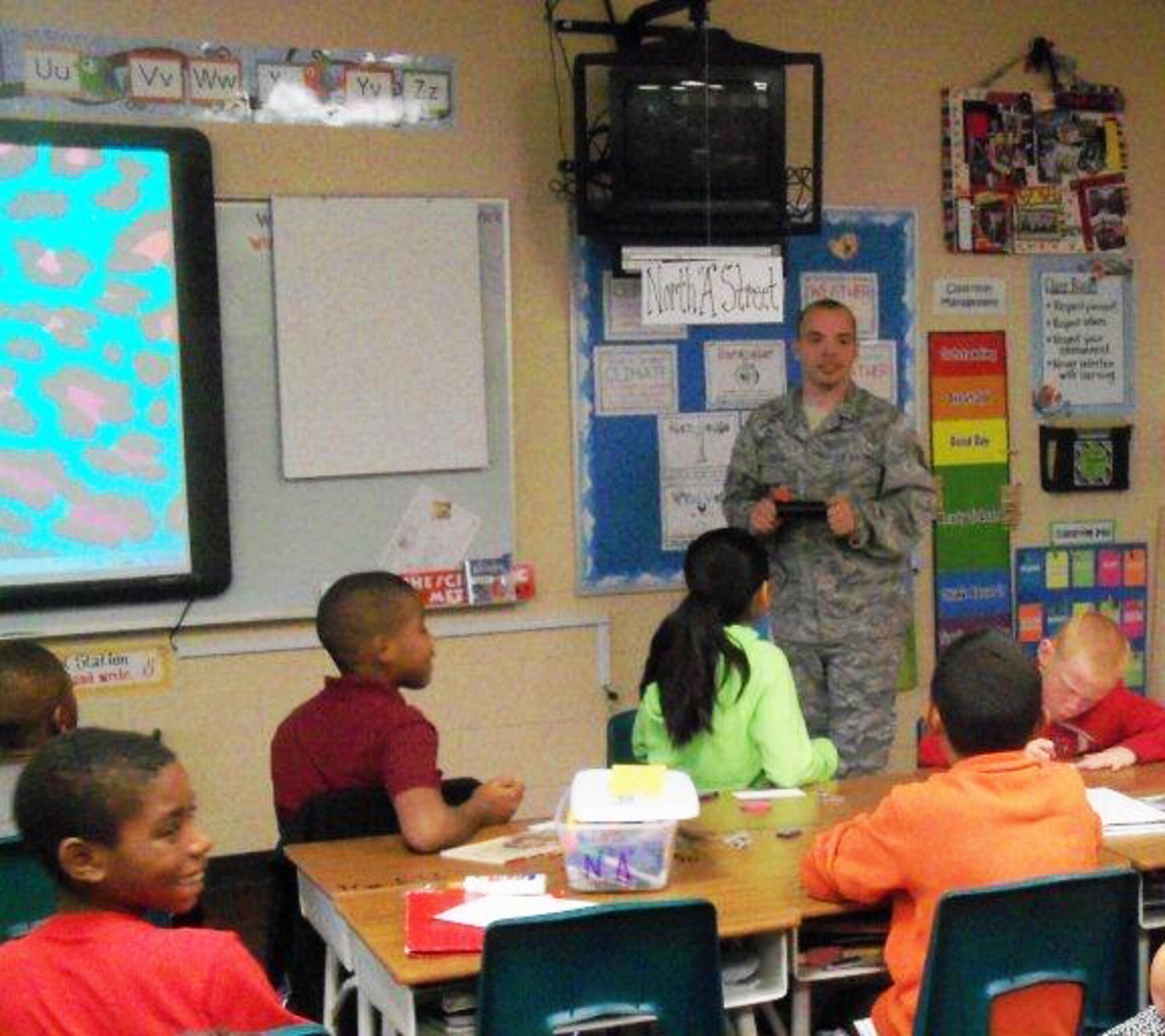 Tech Sgt. Chris Cooper speaks with local students at Fort Smith (Ark.) Sutton Elementary School during the school’s career day. Cooper is a crew chief with the 188th Aircraft Maintenance Squadron. Cooper spoke to the class as part of the Fort Smith School District’s Partners in Education program. The 188th Fighter Wing has been Sutton’s partner for more than 20 years. (Courtesy photo)