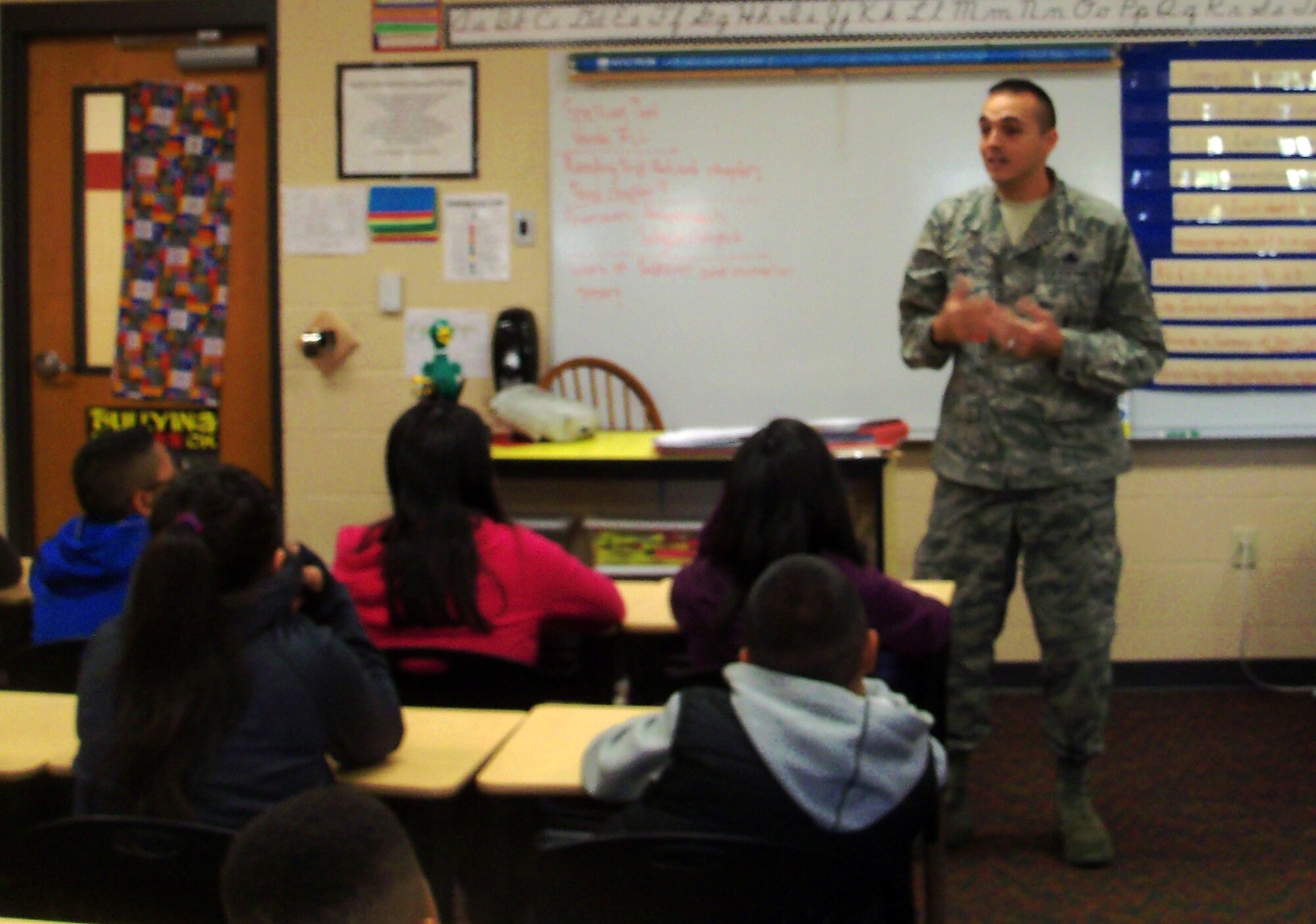 Master Sgt. Michael Aponte speaks with local students at Fort Smith (Ark.) Sutton Elementary School during the school’s career day. Aponte is a weapons specialist with the 188th Aircraft Maintenance Squadron. Aponte spoke to the class as part of the Fort Smith School District’s Partners in Education program. The 188th Fighter Wing has been Sutton’s partner for more than 20 years. (Courtesy photo)