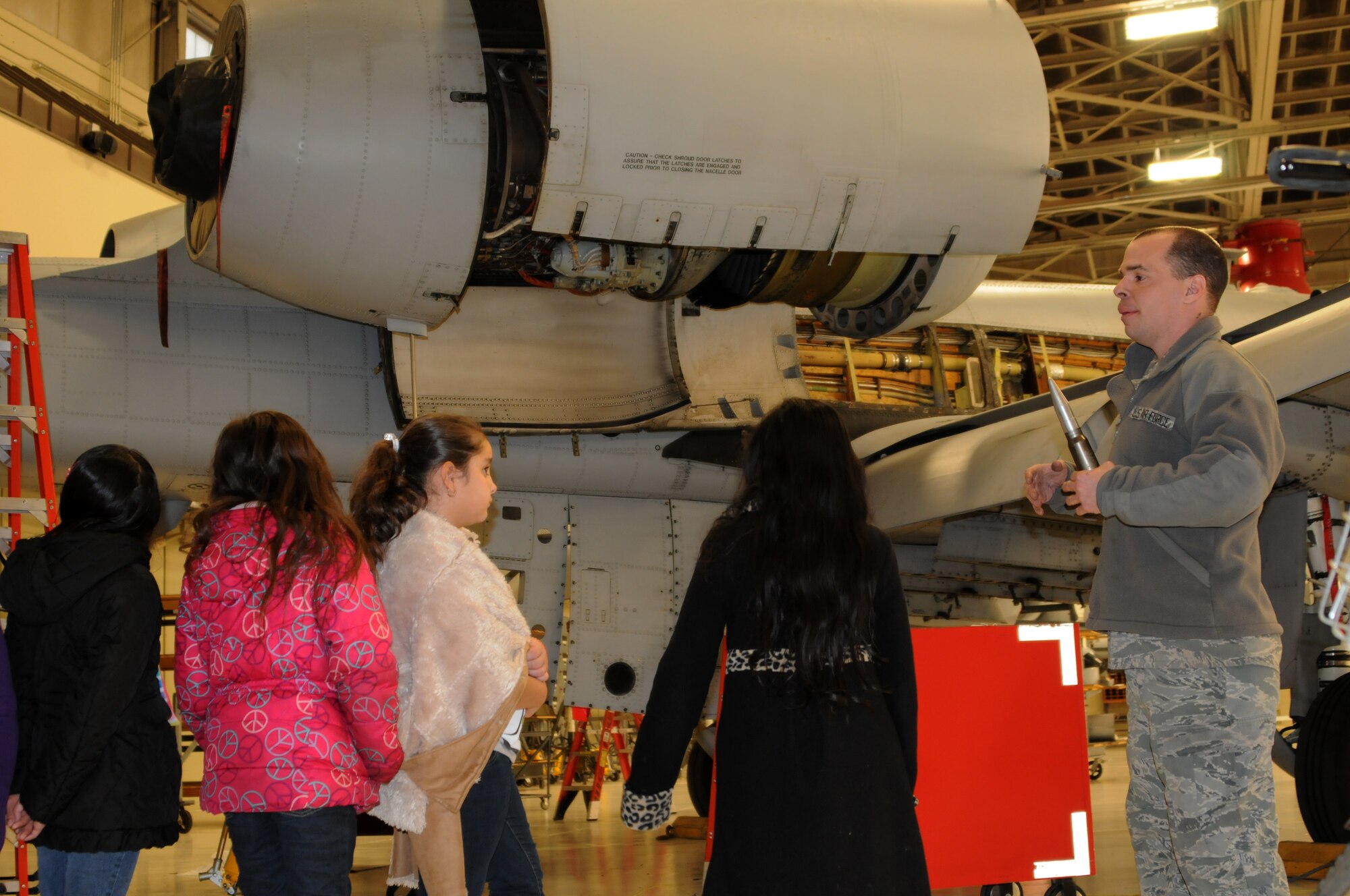 Tech Sgt. Chris Cooper gives students with Fort Smith (Ark.) Sutton Elementary School a guided tour around an A-10C Thunderbolt II “Warthog” during a tour of the 188th Fighter Wing’s Ebbing Air National Guard Base Jan. 29, 2014, as part of the Fort Smith School District’s Partners in Education program. The 188th has been Sutton’s partner for more than 20 years. Sutton toured the 188th’s hangar, fire station and Security Forces Squadron during its visit. The group also had lunch in the 188th’s Citizen Airmen Dining Hall. (U.S. Air National Guard photo by Maj. Heath Allen)