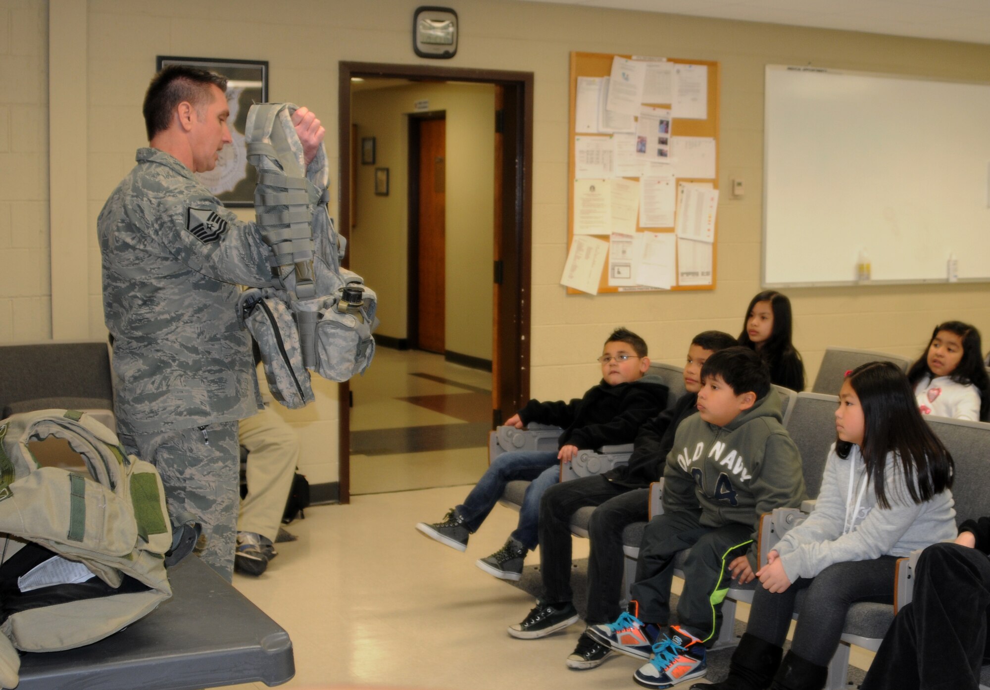 Master Sgt. Mike Walker, 188th Security Forces Squadron, shows the tools of his trade to students with Fort Smith (Ark.) Sutton Elementary School. Sutton toured the 188th Fighter Wing’s Ebbing Air National Guard Base Jan. 29, 2014, as part of the Fort Smith School District’s Partners in Education program. The 188th has been Sutton’s partner for more than 20 years. Sutton toured the 188th’s hangar, fire station and Security Forces Squadron during its visit. The group also had lunch in the 188th’s Citizen Airmen Dining Hall. (U.S. Air National Guard photo by Maj. Heath Allen)