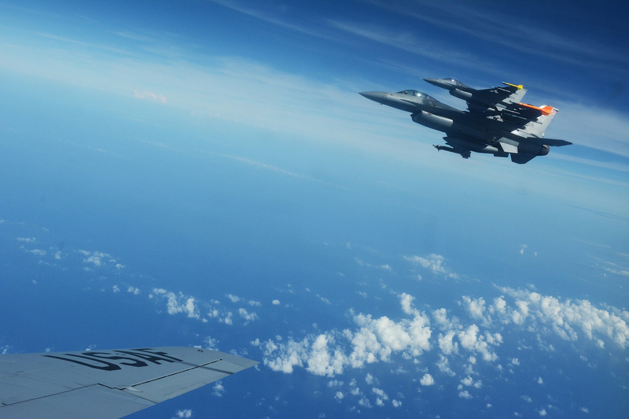 Air National Guard F-16 Fighting Falcons assigned to the 115th Fighter Wing fly to the side of a KC-135 Stratotanker during a training exercise near Key West, Fla., Feb. 5, 2014. The 115th FW came to Key West in February to reduce the likelihood of flight cancelations due to weather. The deployment that lasted almost two weeks allowed the pilots to test their expertise against dissimilar aircraft. (Air National Guard photo by Senior Airman Andrea F. Liechti)