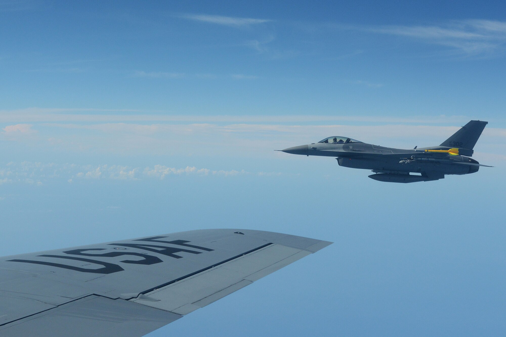 An Air National Guard F-16 Fighting Falcon assigned to the 115th Fighter Wing flies to the side of a KC-135 Stratotanker during a training exercise near Key West, Fla., Feb. 5, 2014. The 115th FW came to Key West in February to reduce the likelihood of flight cancelations due to weather. The deployment that lasted almost two weeks allowed the pilots to test their expertise against dissimilar aircraft. (Air National Guard photo by Senior Airman Andrea F. Liechti)