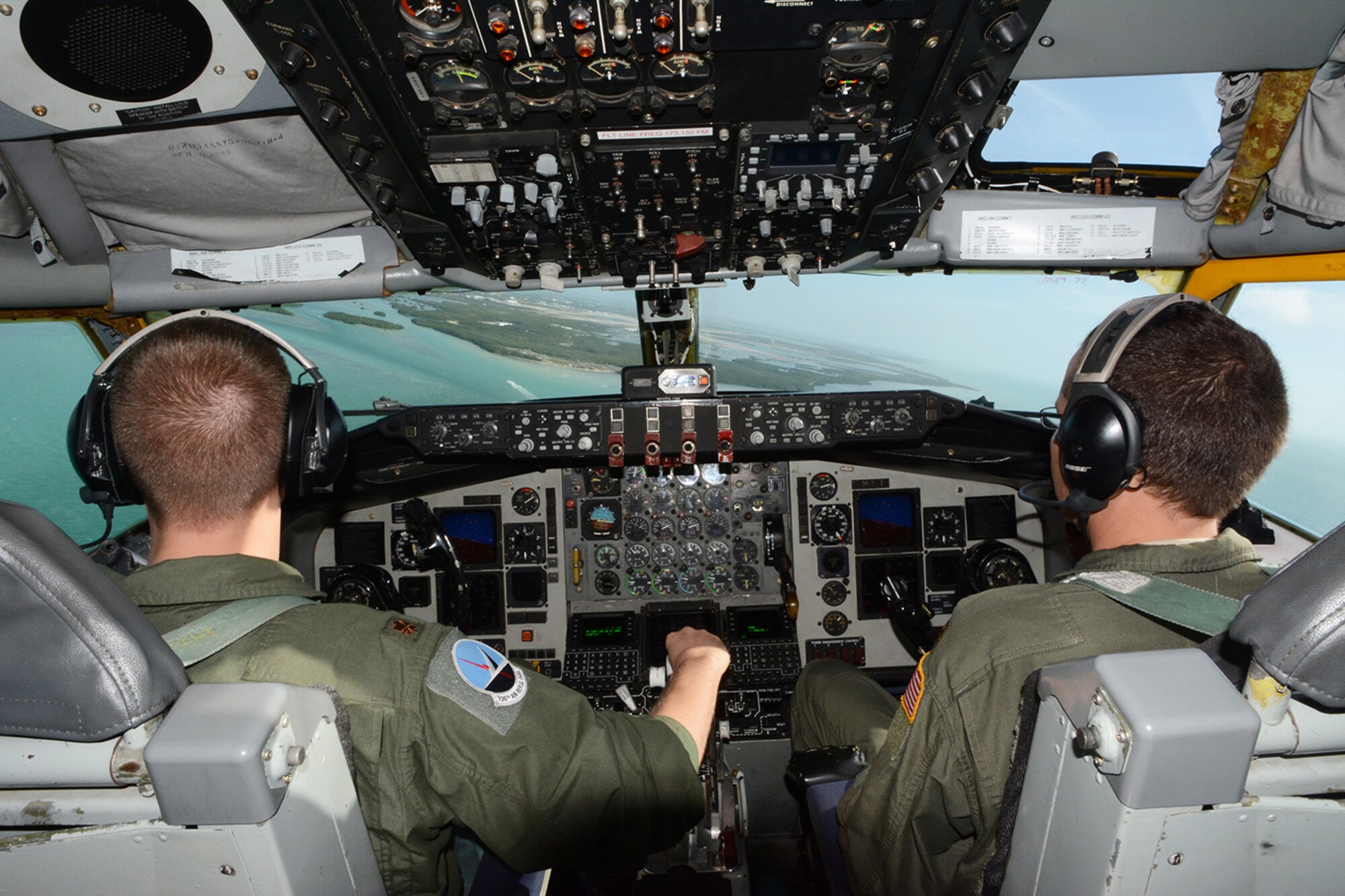 Maj. Mike Dirnberger, 128th Air Refueling Wing pilot, and Maj. Robert Ulander, 128th ARW co-pilot, prepare the KC-135 Stratotanker for a landing onto Naval Air Station Key West, Key West, Fla., Feb. 5, 2014. The pilots and their crew allowed Airmen assigned to the 115th Fighter Wing an incentive ride so they could watch an air refueling live. (Air National Guard photo by Senior Airman Andrea F. Liechti)