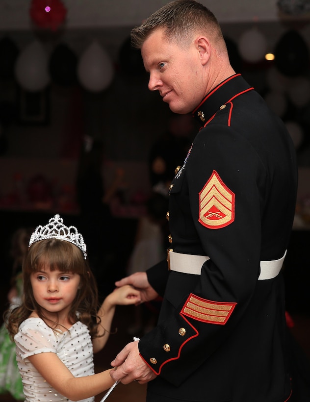 Staff Sgt. James Anderson, electronic key manager, 3rd Combat Engineers Battalion, shares a dance with his daughter, Paige Anderson, 6 years old, during the "Princess of the Castle" event Feb. 7, 2014 at the Officers' Club. The event featured dinner, dancing, and a disc jockey for fathers and daughters to have a special night.


