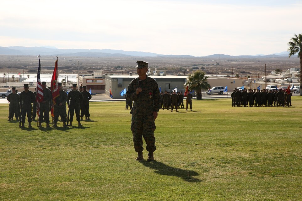 Sgt. Maj. Insu Paek, former Marine Corps Communication-Electronics School sergeant major, speaks to the attendees during a Relief and Appointment and Retirement Ceremony at Lance Cpl. Torrey L. Gray Field, Feb. 12, 2014.