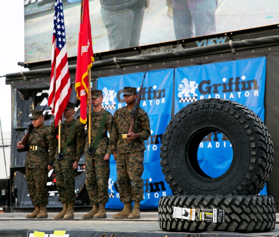 The Combat Center’s base color guard stands at attention moments before racers take their marks during the final face of the 2014 King of the Hammers event in Johnson Valley, Calif., Feb. 7. During the final race, Loren Healy, the 2010 winner of the event, left his competition in the dust reclaiming a victory in the 2014 event. (Official Marine Corps Photo By Lance Cpl. Kasey Peacock/Released)


