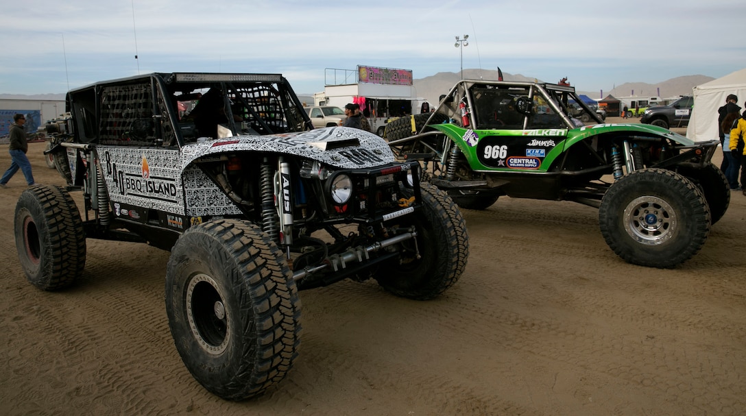 Various Ultra 4 vehicle drivers make their way to the starting line for the last race of the 2014 King of the Hammers event in Johnson Valley, Calif., Feb. 7. The Ultra 4 vehicles can reach speeds higher than 100 miles per hour for the desert sections, and still contain gear ratios of 100 to 1 or lower for technical rock crawling. (Official Marine Corps Photo By Lance Cpl. Kasey Peacock/Released)


