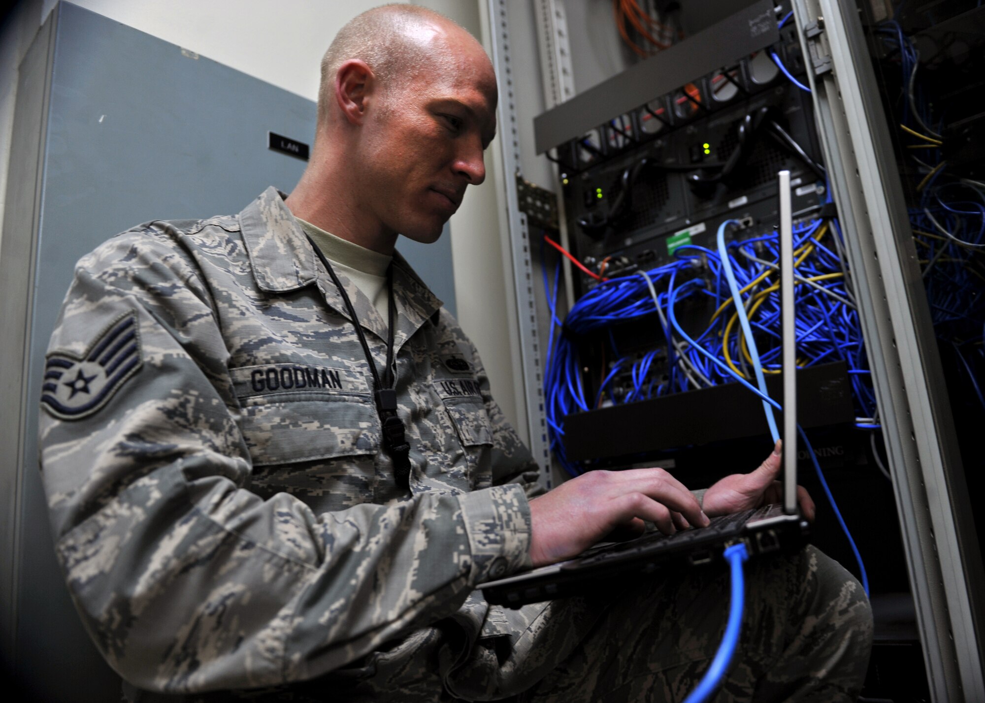 Staff Sgt. James Goodman, 51st Communications Squadron cyber transport supervisor, troubleshoots a network issue on a laptop at Osan Air Base, Republic of Korea, Feb. 18, 2014. Goodman is this week’s Airman Spotlight winner. (U.S. Air Force photo/Senior Airman Siuta B. Ika)