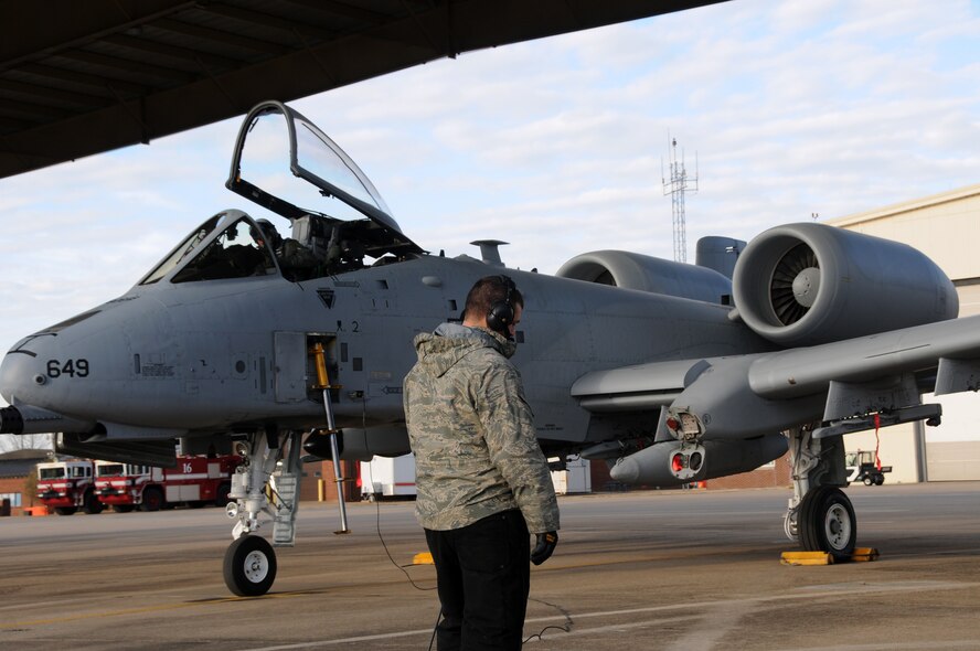 Master Sgt. Michael Wilmoth, a crew chief with the 188th Aircraft Maintenance Squadron, communicates with Lt. Col. John Gonzales, 23rd Operations Support Squadron commander, during preflight inspections Feb. 11, 2014. Gonzales delivered Tail No. 649, one of the 188th Fighter Wing’s A-10C Thunderbolt II “Warthogs,” from Ebbing Air National Guard Base in Fort Smith, Ark., to Moody Air Force Base, Ga., as part of the 188th’s conversion from an A-10 mission to a remotely piloted aircraft, intelligence and targeting mission. The 188th now has seven A-10s remaining on station. The last two Warthogs are slated to depart in June 2014. (U.S. Air National Guard photo by Senior Airman John Hillier/released)
