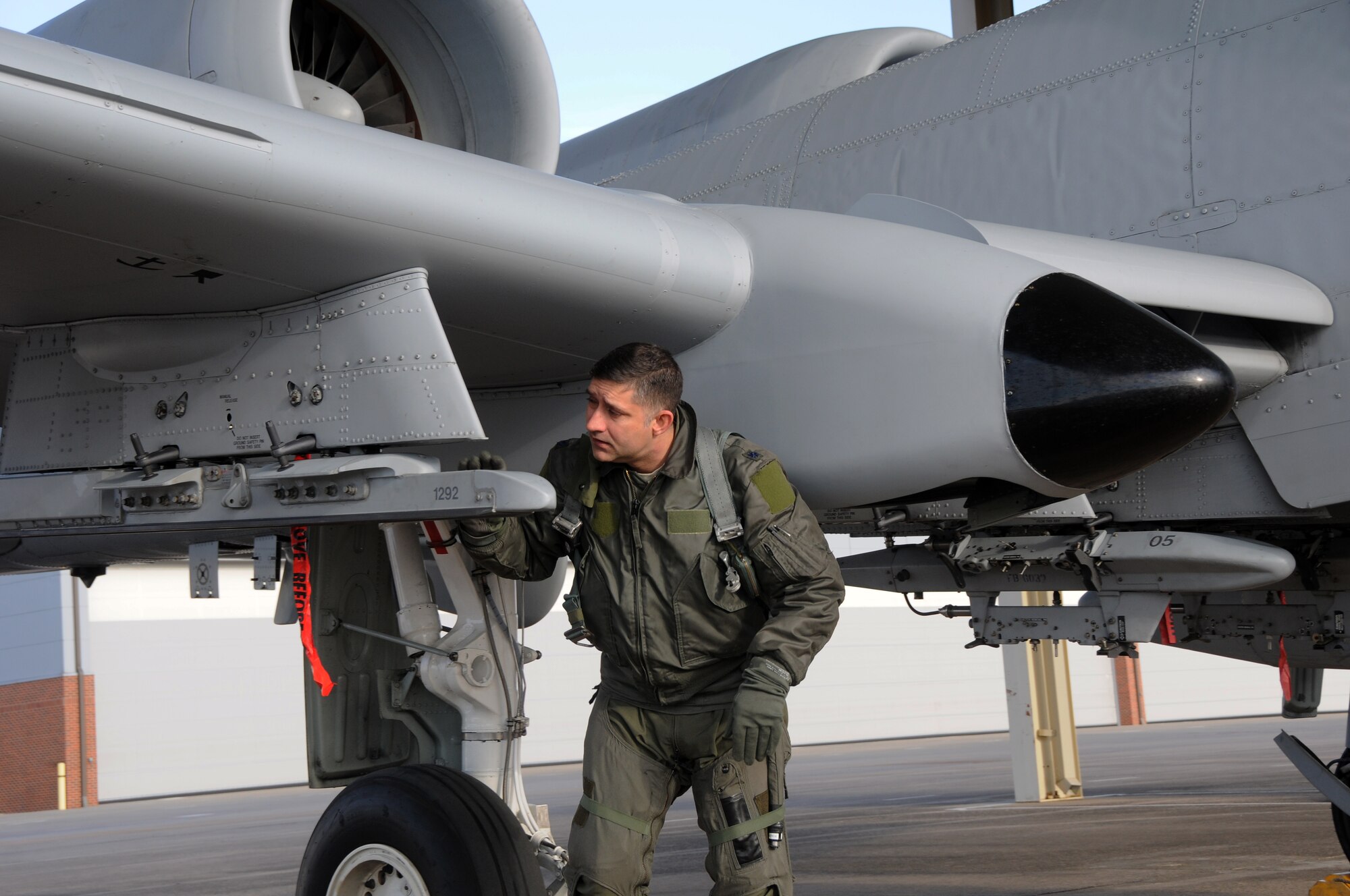 Lt. Col. John Gonzales, 23rd Operations Support Squadron commander, performs preflight inspections on Tail No. 649, a 188th Fighter Wing A-10C Thunderbolt II “Warthog,” before delivering the aircraft to Moody Air Force Base, Ga., Feb. 11, 2014. The 188th is undergoing a mission conversion from A-10s to remotely piloted aircraft with an intelligence and targeting mission. The 188th now has seven A-10s remaining on station. The last two Warthogs are slated to depart in June 2014. (U.S. Air National Guard photo by Senior Airman John Hillier/released)