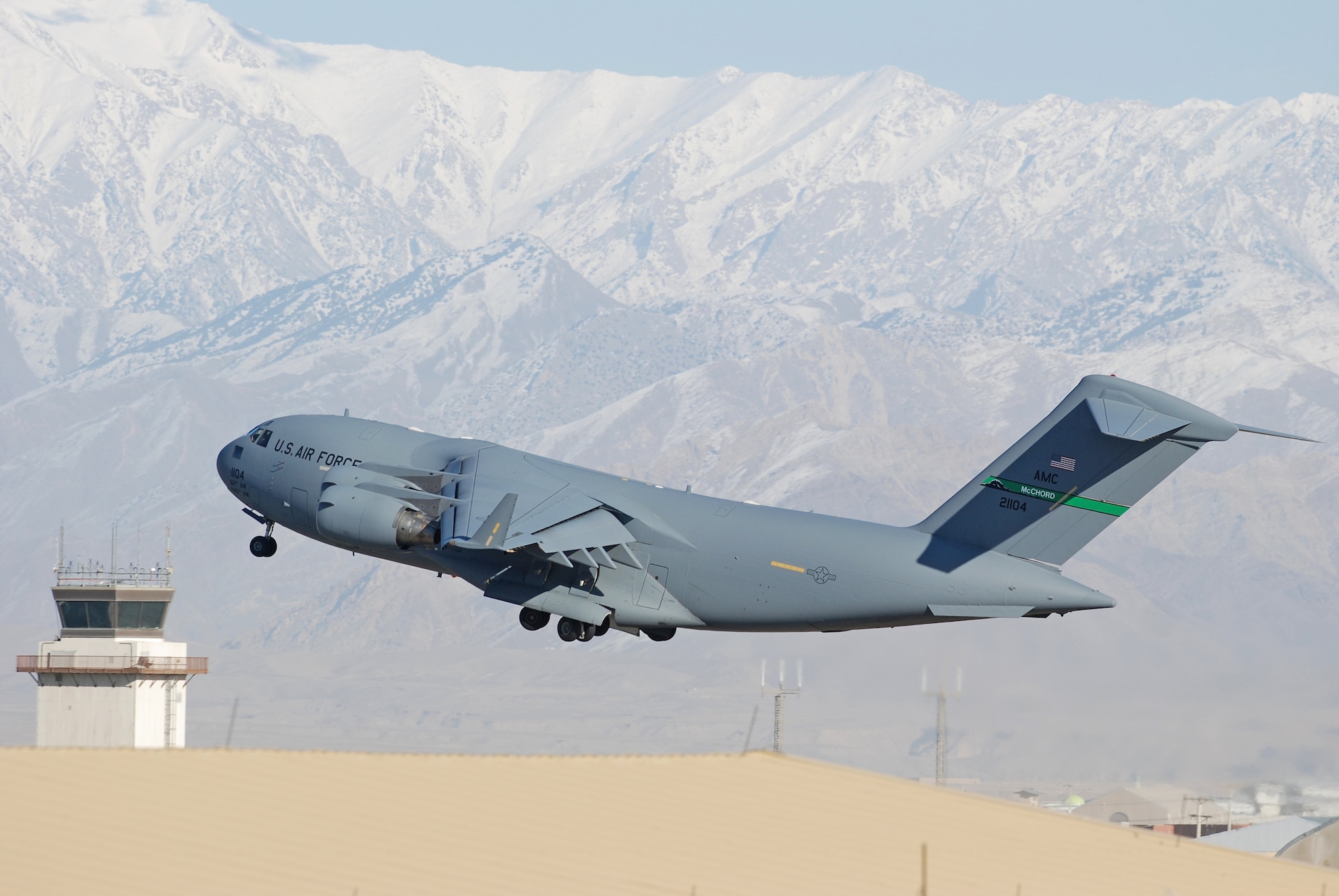A C-17 Globemaster III takes off from Bagram Airfield, Afghanistan, Feb. 15, 2014. Strong winds allowed a clear sky during the morning. (U.S. Air Force photo by Capt. Brian Wagner/Released)