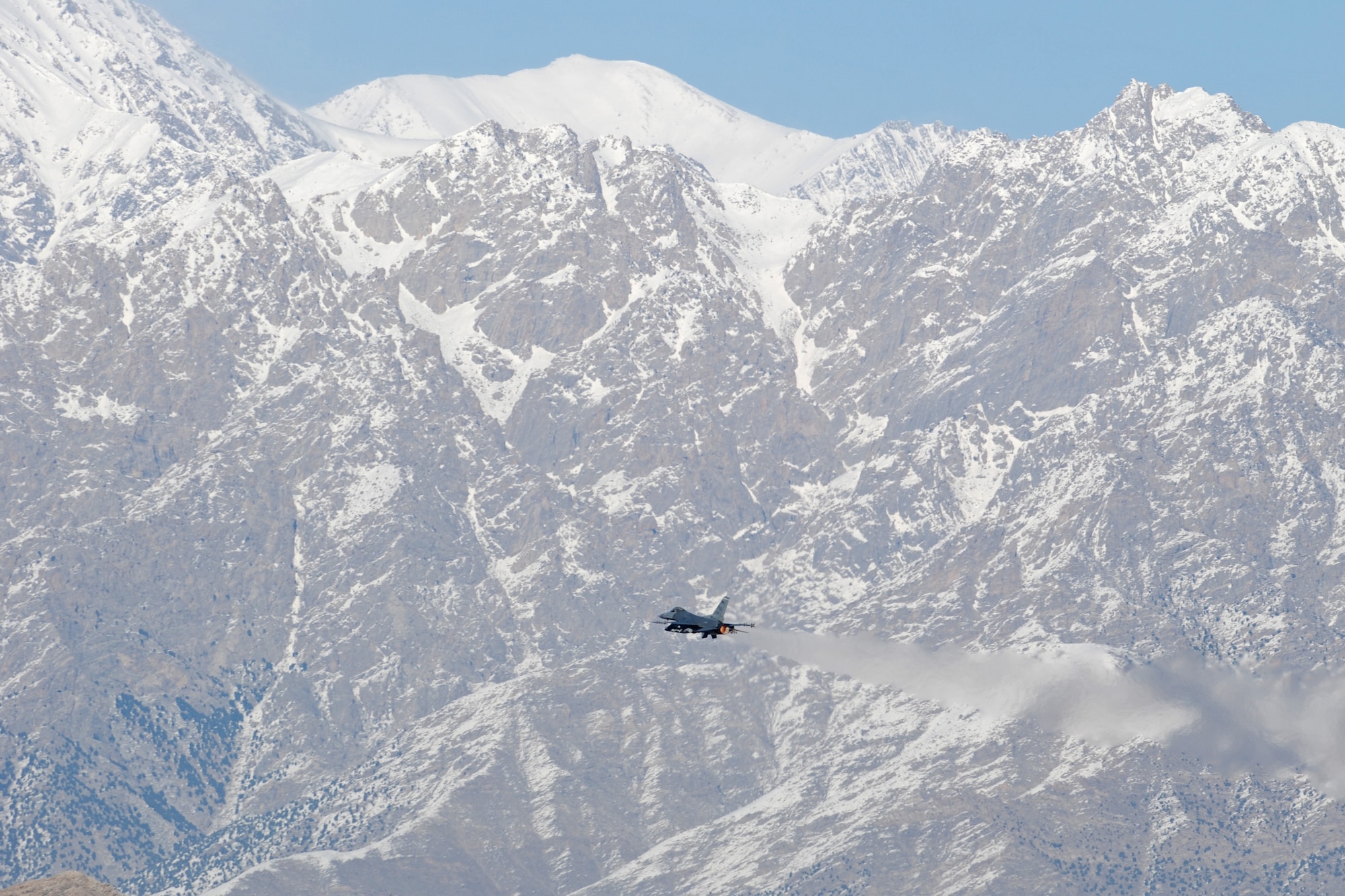 A F-16 Fighting Falcon takes off from Bagram Airfield, Afghanistan, Feb. 15, 2014. There were strong winds at Bagram Airfield in the morning, which enabled the normal haze in the valley to clear. (U.S. Air Force photo by Capt. Brian Wagner/Released)