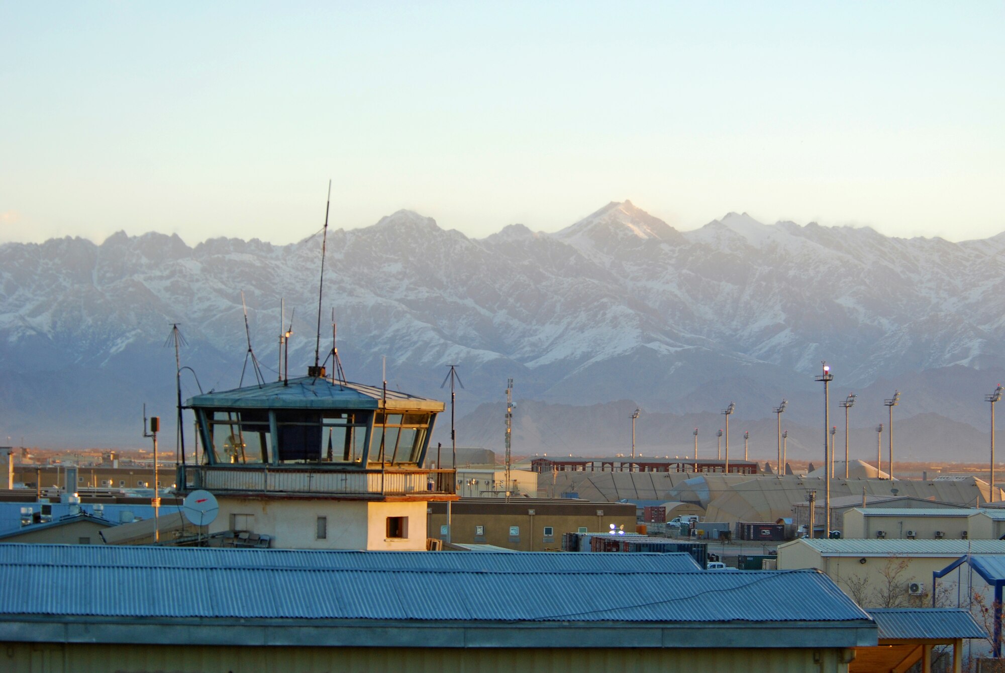 Sun shines on the former control tower at Bagram Airfield, Afghanistan, Feb. 15, 2014. There were strong winds at Bagram Airfield in the morning, which enabled the normal haze in the valley to clear. (U.S. Air Force photo by Capt. Brian Wagner/Released)