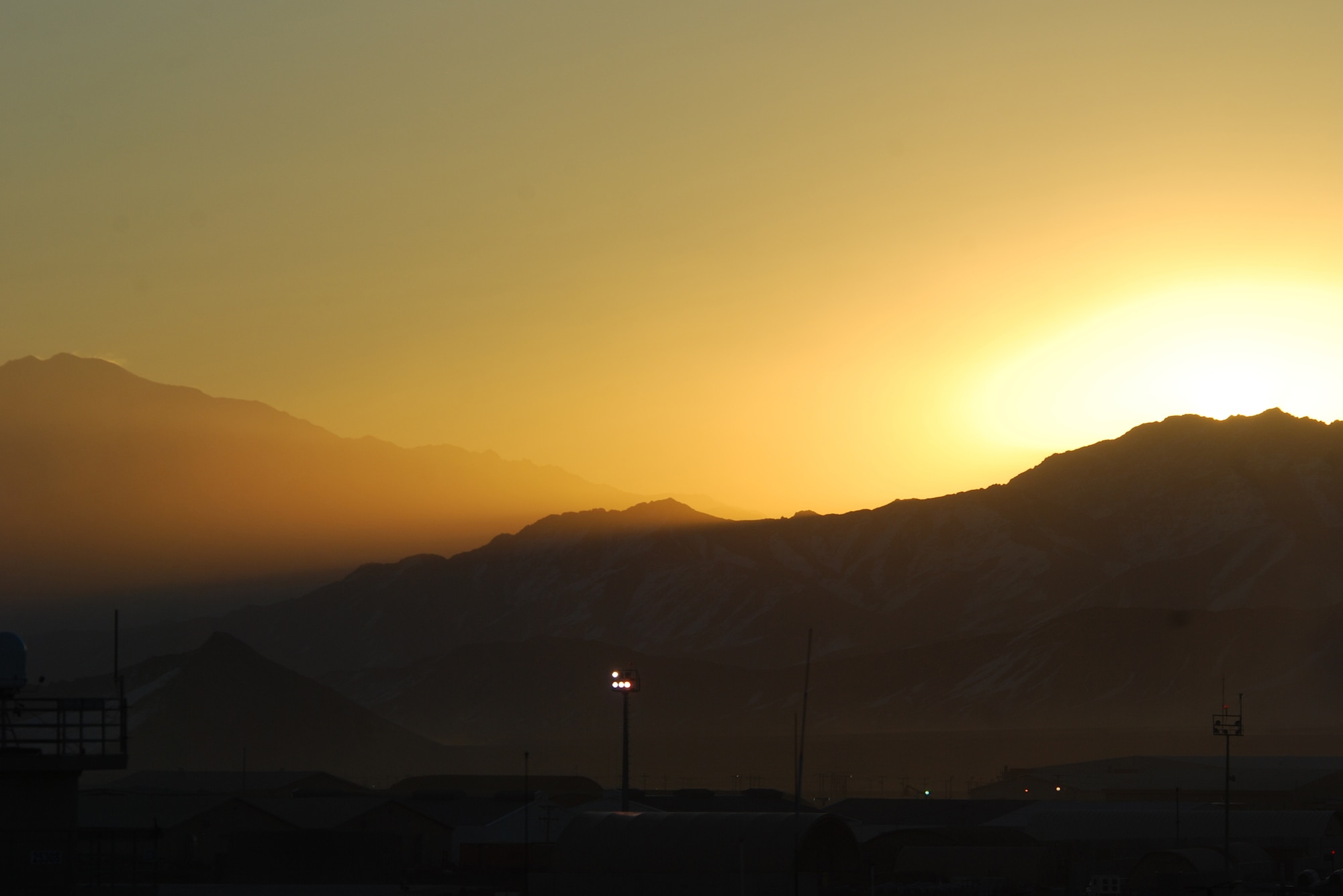 A sunrise occurs at Bagram Airfield, Afghanistan, Feb. 15, 2014. Strong winds allowed a clear sky during the morning. (U.S. Air Force photo by Capt. Brian Wagner/Released)