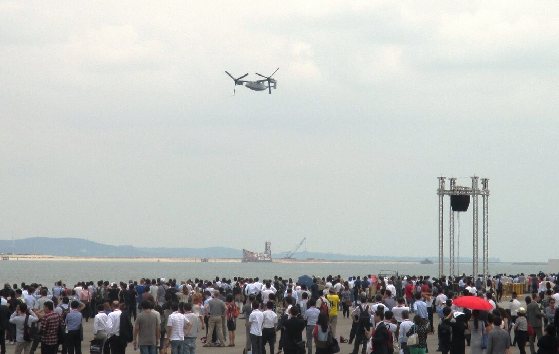 An Osprey flies in front of a crowd of 40,000 spectators Feb. 14 during the Singapore International Airshow 2014. The Singapore Air Show 2014 helps build stronger relations between the U.S. and Singapore, as well as among the international community. The event promotes military to military discussions on aircraft and equipment, which enables greater interoperability of aviation platforms, and furthers international military relationships and cooperation. The U.S. is committed to maintaining peace and stability in the region, and this event demonstrates a focus of the U.S. rebalance to the Asia-Pacific region. The Osprey is with Marine Medium Tiltrotor Squadron 262, Marine Aircraft Group 36, 1st Marine Aircraft Wing, III Marine Expeditionary Force. (U.S. Marine Corps photo by Capt. Caleb D. Eames/Released)