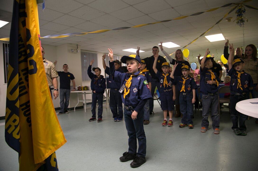 Caden Day, a seven-year-old cub scout with Cub Scout Pack 283, recites the Cub Scout Promise during the Blue and Gold Ceremony aboard Laurel Bay, Feb. 7. This promise helps cub scouts develop a sense of spiritual awareness, loyalty, unselfishness, self-discipline, and service to others.