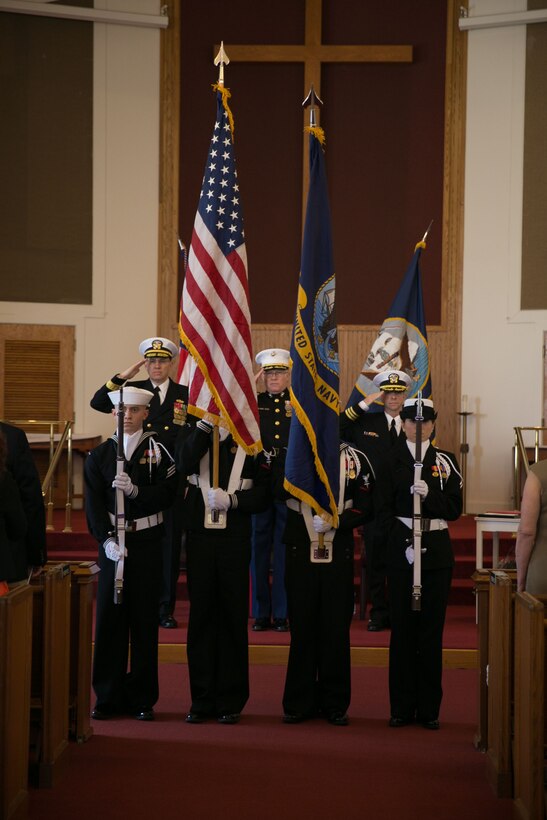 Cmdr. Dean Hoelz, Marine Corps Air Station Beaufort chaplain, Col. Brian Murtha, MCAS Beaufort commanding officer and Rear Adm. Doug Morton, commander of Naval Facilities Engineering Command, Atlantic, present salutes during Hoelz’ retirement ceremony at the MCAS Beaufort chapel, Feb. 7. Hoelz served in the Army and in the Navy Chaplain Corps for more than 30 years.