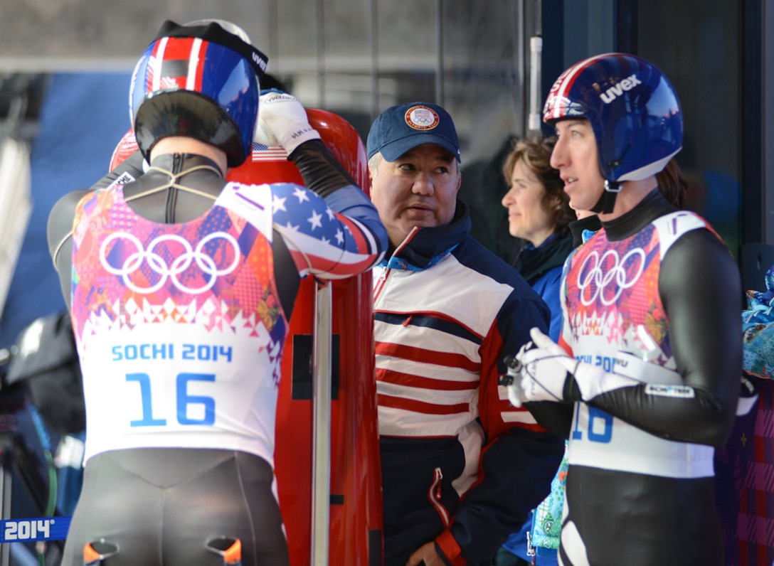 U.S. Army World Class Athlete Program and Team USA luge coach Staff Sgt. Bill Tavares, center, talks with Sgt. Preston Griffall, and Sgt. Matt Mortensen, left, before the first heat of the Olympic luge doubles event Feb. 12, 2014, in Krasnaya Polyana, Russia. U.S. Army photo by Tim Hipps  