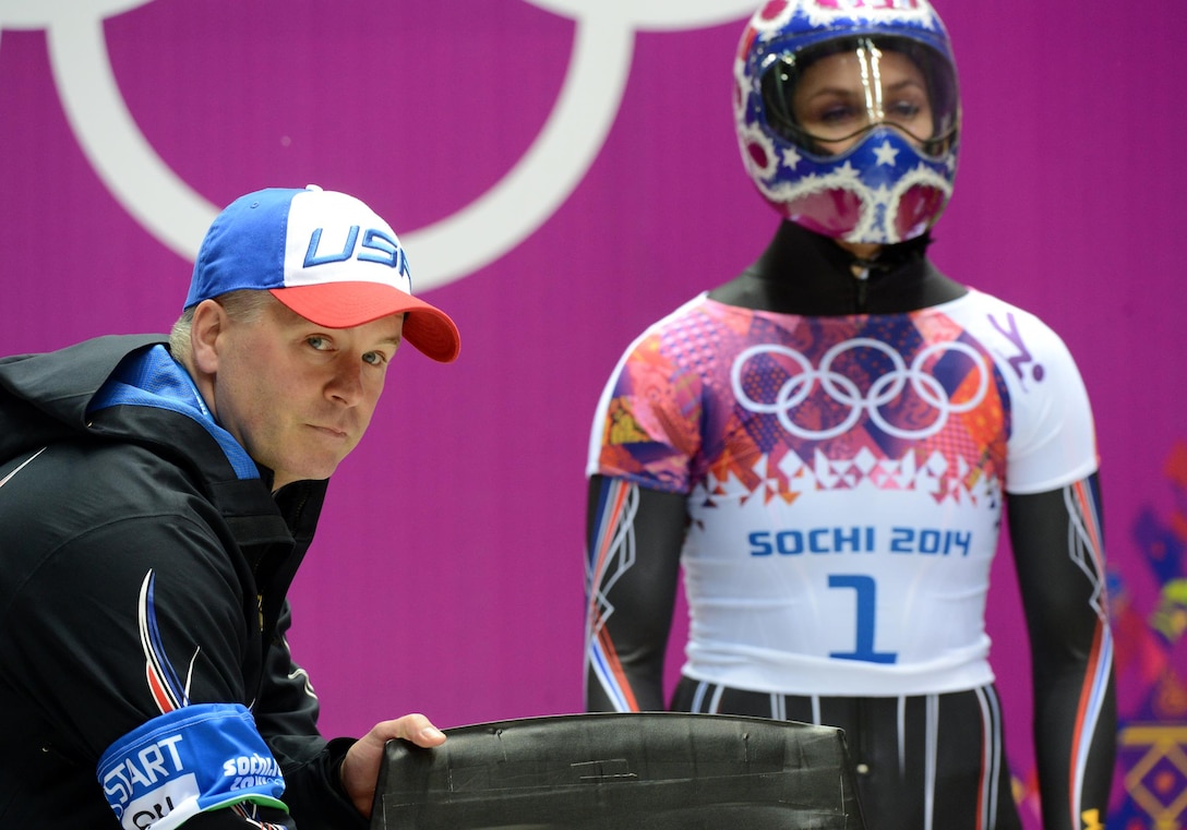 U.S. Army World Class Athlete Program and Team USA skeleton coach Tuffy Latour leads Noelle Pikus-Pace (right) to an Olympic silver medal and Katie Uehlander to a fourth-place finish in women's skeleton Friday night at Sanki Sliding Centre in Krasnaya Polyana, Russia. U.S. Army photo by Tim Hipps, IMCOM Public Affairs