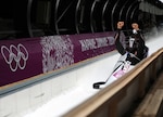 Former U.S. Army World Class Athlete Program bobsled driver Steven Holcomb of Park City, Utah, raises his fists in celebration of his Olympic bronze medal performance with Steven Langton of Melrose, Mass., aboard USA-1 in the two-man bobsled event Feb. 17 at Sanki Sliding Centre in Krasnaya Polyana, Russia. (U.S. Army photo by Tim Hipps, IMCOM Public Affairs.)