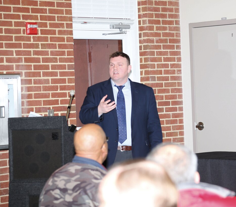 John P. McHugh, senior contracts attorney, Office of Counsel, Marine Corps Logistics Command, briefs small business owners at a Coffee Series event held Jan. 28 in downtown Albany, Ga., to help small business owners learn about LOGCOM’s small business program. 