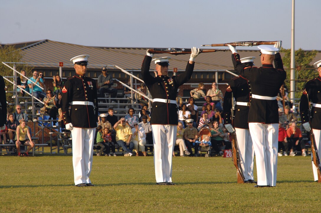 Members of the U.S. Marine Corps Silent Drill Platoon perform during the 2012 Battle Color Ceremony at Schmid Field aboard Marine Corps Logistics Base Albany. MCLB Albany officials are planning to host the awe-inspiring event here, March 17 at 1 p.m., which is free and open to the public.