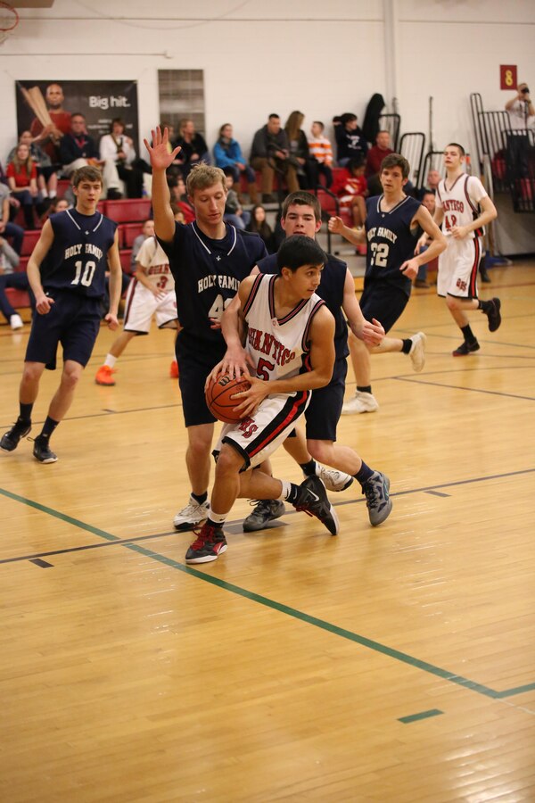 David, sophomore, looks for a teammate during a game against the Holy Family Academy, from Manassas, at the Quantico Middle/School on Feb. 11, 2014. The Warriors beat the Vendeens 77-65.