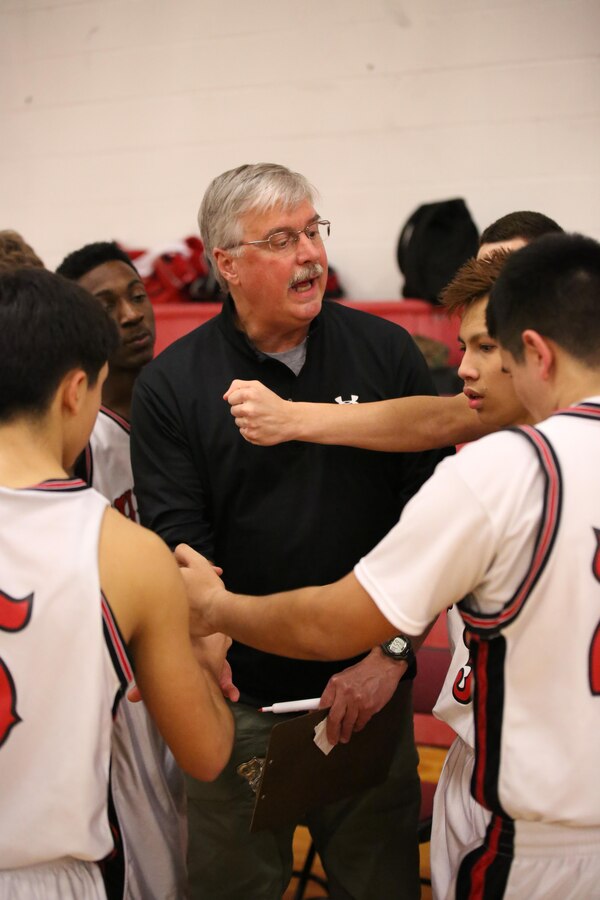 Eddie Cottrell, Warriors’ head coach, talks to his team during a time out at Quantico Middle/High School on Feb. 11, 2014. The boys beat Holy Family Academy 77-65.