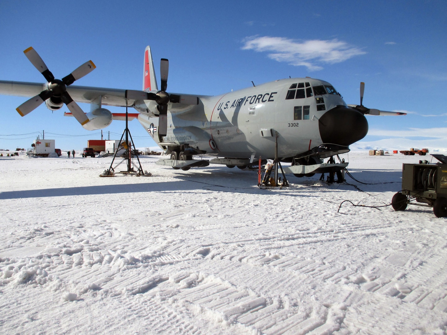 An LC-130 Skibird from the New York Air National Guard is jacked up on the frozen ice shelf of Pegasus Field Jan. 16, 2014, after aircrew discovered a landing gear issue. The maintenance crews of the 109th Airlift Wing do not have hangars to work out of while deployed to Antarctica for Operation DEEP FREEZE and must work in the elements and handle unique challenges nearly every day.
