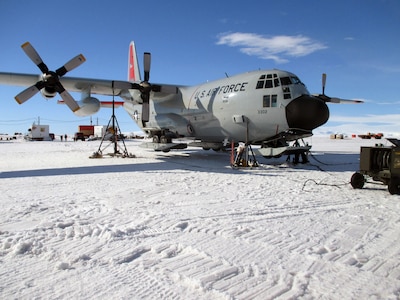 An LC-130 Skibird from the New York Air National Guard is jacked up on the frozen ice shelf of Pegasus Field Jan. 16, 2014, after aircrew discovered a landing gear issue. The maintenance crews of the 109th Airlift Wing do not have hangars to work out of while deployed to Antarctica for Operation DEEP FREEZE and must work in the elements and handle unique challenges nearly every day.