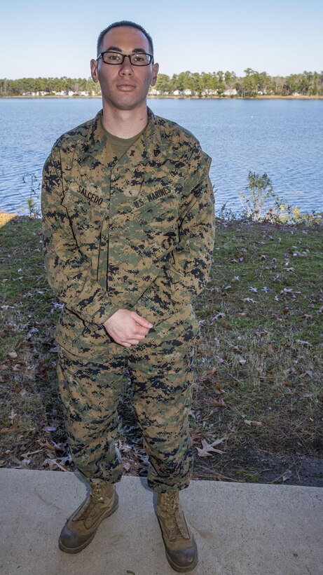 U.S. Marine Corps Cpl. Roberto A. Salcedo, an administrative specialist with the 26th Marine Expeditionary Unit (MEU) and a Los Angeles native, poses for a photo outside the 26th MEU command post aboard Marine Corps Base camp Lejeune, N.C., Dec. 16, 2013. Salcedo deployed for eight months with the MEU during its deployment to the 5th and 6th Fleet areas of responsibility from March 5, 2013 to November 7, 2013. (U.S. Marine Corps photo by Lance Cpl. Joshua W. Brown/released)