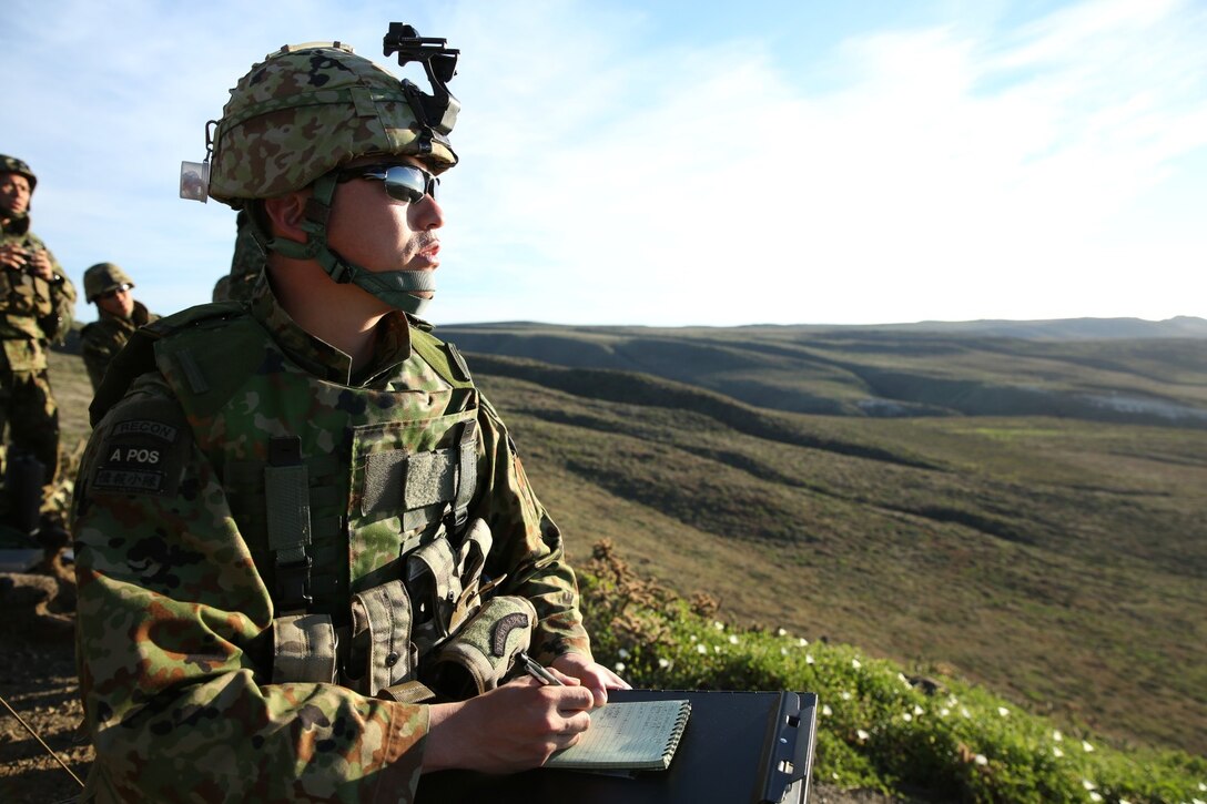 A soldier with the Japan Ground Self-Defense Force plots his targets while training with U.S. Marines from 1st Air Naval Gunfire Liaison Company during Exercise Iron Fist 2014 aboard San Clemente Island, Calif., Feb. 13, 2014. Iron Fist 2014 is an amphibious exercise that brings together Marines and sailors from the 15th Marine Expeditionary Unit, other I Marine Expeditionary Force units, and soldiers from the JGSDF, to promote military interoperability and hone individual and small-unit skills through challenging, complex and realistic training. (U.S. Marine Corps photo by Lance Cpl. Anna K. Albrecht/Released)