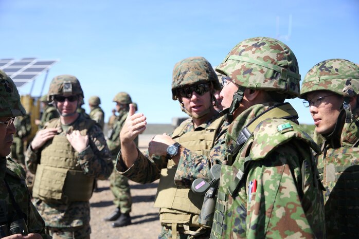 U.S. Marine Lt. Col. Bill Wischmeyer, executive officer, 15th Marine Expeditionary Unit, speaks with Maj. Gen. Hiroaki Kawamoto, deputy chief of staff (operations), Western Army, Japan Ground Self-Defense Force during Exercise Iron Fist 2014 aboard San Clemente Island, Calif., Feb. 13, 2014. Iron Fist is an amphibious exercise that brings together Marines and sailors from the 15th MEU, other I Marine Expeditionary Force units, and soldiers from the JGSDF, to promote military interoperability and hone individual and small-unit skills through challenging, complex and realistic training. (U.S. Marine Corps photo by Lance Cpl. Ricardo Hurtado/Released)