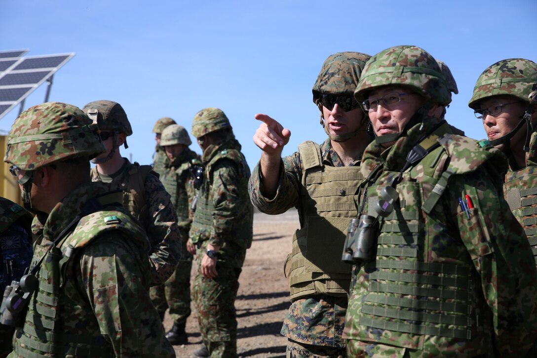 U.S. Marine Lt. Col. Bill Wischmeyer, executive officer, 15th Marine Expeditionary Unit, speaks with Maj. Gen. Hiroaki Kawamoto, deputy chief of staff (operations), Western Army, Japan Ground Self-Defense Force during Exercise Iron Fist 2014 aboard San Clemente Island, Calif., Feb. 13, 2014. Iron Fist is an amphibious exercise that brings together Marines and sailors from the 15th MEU, other I Marine Expeditionary Force units, and soldiers from the JGSDF, to promote military interoperability and hone individual and small-unit skills through challenging, complex and realistic training. (U.S. Marine Corps photo by Lance Cpl. Ricardo Hurtado/Released)