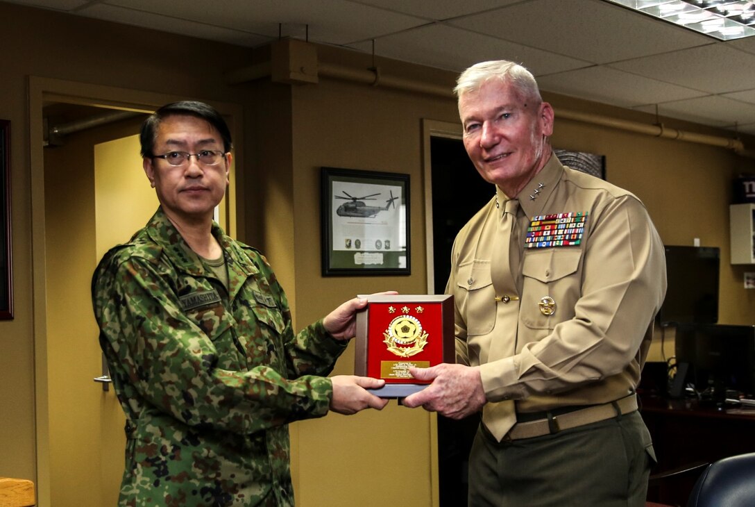 Lieutenant Gen. Hirotaka Yamashita, vice chief of staff, left, Japan Ground Self-Defense Force, presents U.S. Marine Lt. Gen. John A. Toolan, commanding general, I Marine Expeditionary Force, with a plaque during Exercise Iron Fist 2014 aboard Camp Pendleton, Calif., Feb. 14. Iron Fist is an amphibious exercise that brings together Marines and sailors from the 15th Marine Expeditionary Unit, other I Marine Expeditionary Force units, and soldiers from the JGSDF, to promote military interoperability and hone individual and small-unit skills through challenging, complex and realistic training. (U.S. Marine Corps photo by Cpl. Emmanuel Ramos/Released)