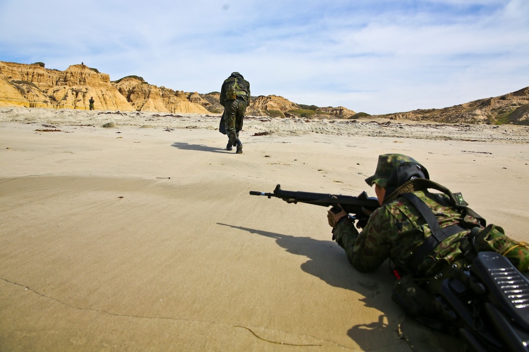 Soldiers from the Japan Ground Self-Defense Force secure a beach while conducting an amphibious raid during Exercise Iron Fist 2014 aboard Camp Pendleton, Calif., Feb. 15, 2014. Iron Fist is an amphibious exercise that brings together Marines and sailors from the 15th Marine Expeditionary Unit, other I Marine Expeditionary Force units, and soldiers from the JGSDF, to promote military interoperability and hone individual and small-unit skills through challenging, complex and realistic training. (U.S. Marine Corps photo by Lance Cpl. Ricardo Hurtado/Released)